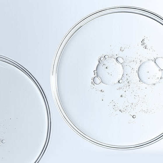 Symbolic graphic (e.g., molecular structure) for niacinamide, which improves texture and minimizes pore/fine line appearance