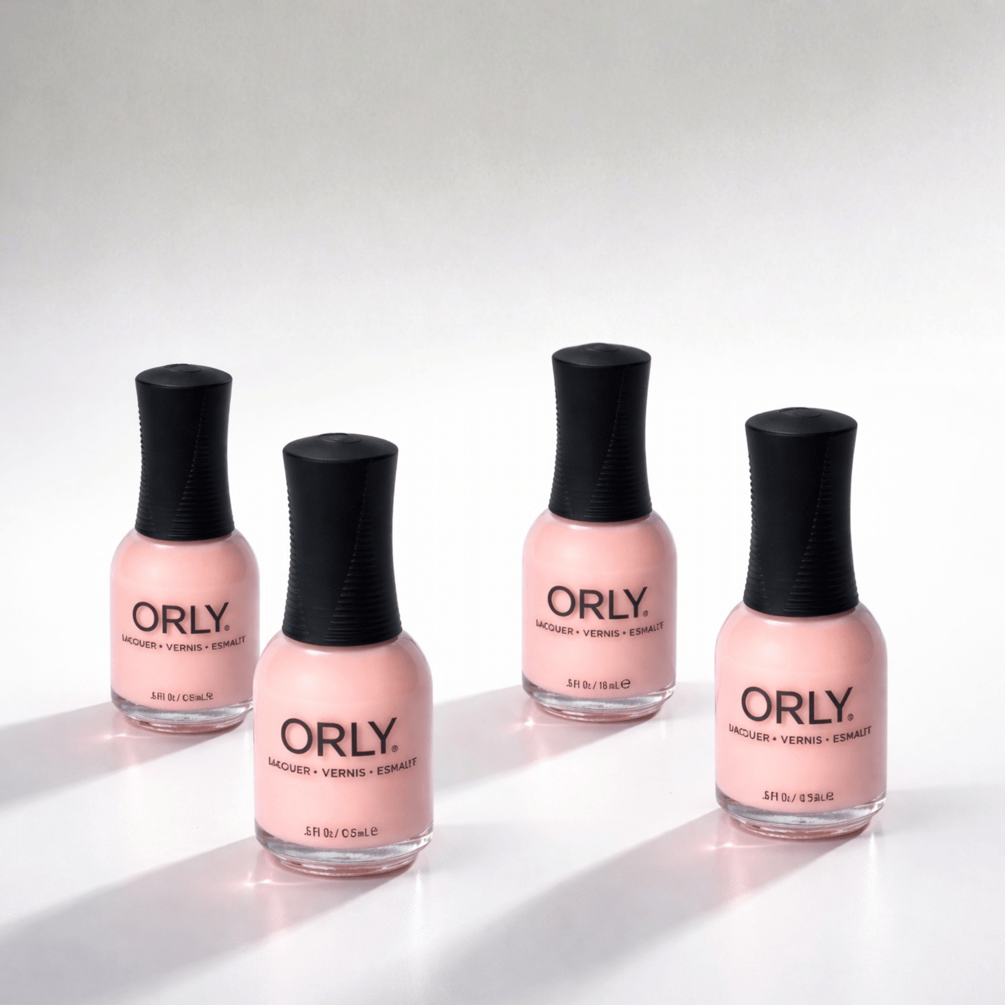 Four bottles of ORLY nail polish on a white background